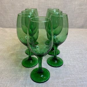 7 Green stemmed water/wine goblets 8” tall.